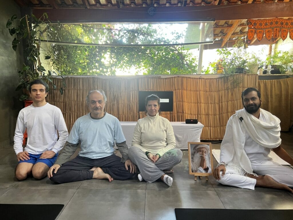 A group of people sitting on the floor.