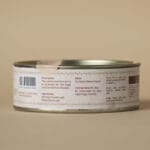 A tin can with a label detailing product information and instructions, including ingredients: 90% moringa powder, 10% maize starch.